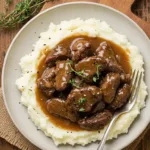 No Peeking Beef Tips Recipe - Tender Beef Tips in Rich Gravy over Mashed Potatoes