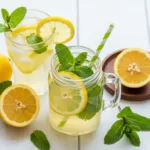 Lemon Balm Recipe for Weight Loss Refreshing lemon balm recipe for weight loss served as iced tea in a glass and mason jar, garnished with lemon and mint.