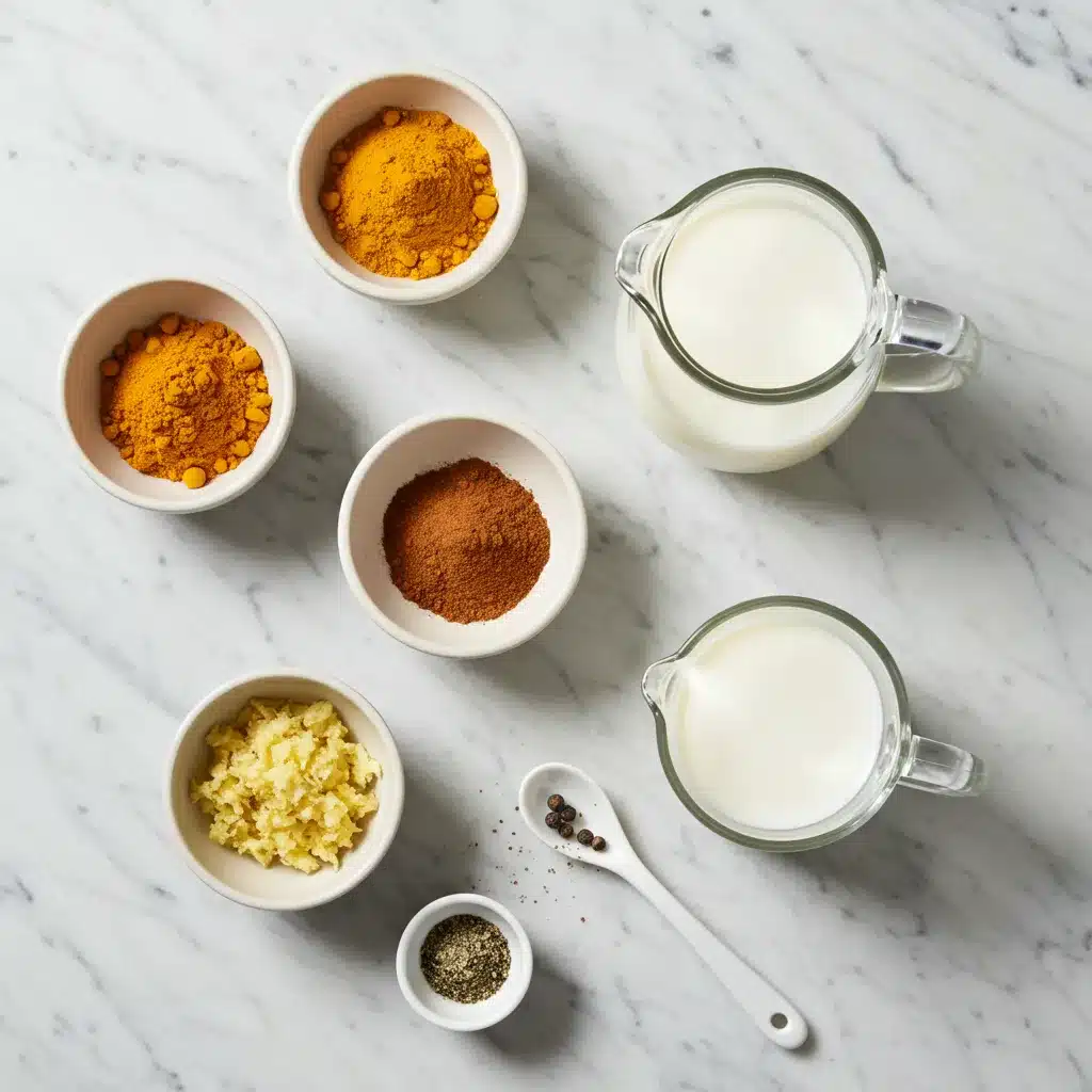 Turmeric Latte Recipe (for a Cozy, Anti-Inflammatory Boost) 3 Ingredients for a turmeric latte recipe, including turmeric, cinnamon, and ginger, laid out on a marble surface.