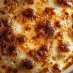 Easy French Onion Soup Recipe (That Tastes Incredibly Authentic) A step-by-step process shot showing deeply caramelized onions for homemade French onion soup in a dutch oven.