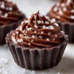 A close-up view of the light and airy texture of the holiday mousse recipe, showing the silky smooth peppermint chocolate filling.