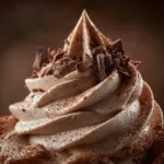 A close-up macro shot showcasing the incredibly smooth and creamy texture of the Nutella cheesecake filling.