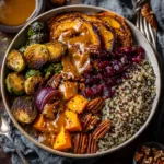 An overhead flat lay of a nourishing harvest quinoa bowl with roasted vegetables. This image shows the colorful ingredients of the Autumn Quinoa Bowl.