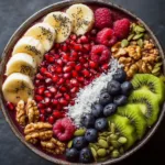 Superfood Breakfast Bowl (Easy, Healthy & Customizable) A close-up shot of a nutrient-dense breakfast bowl filled with colorful fruits, seeds, and nuts on a creamy base. This highlights the fresh ingredients in the superfood bowl.