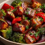 Honey Garlic Chicken: The Ultimate 30-Minute Recipe An extreme close-up shot of a piece of honey garlic chicken, showing the thick, glossy glaze and tender texture of the meat.