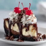 A close-up shot of the brownie bottom cheesecake layer, showing the rich, fudgy brownie base and creamy cheesecake filling.
