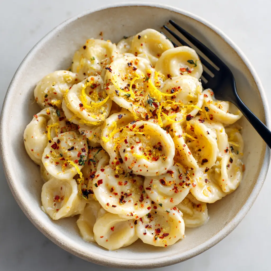 A photorealistic shot of the ingredients for the lemon garlic pasta, including a head of garlic, a lemon, and fresh parsley.