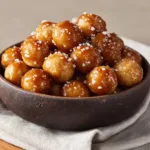 Salted Caramel Cracker Bites: The Easiest Holiday Treat An overhead shot of homemade salted caramel cracker bites arranged neatly on a serving platter.