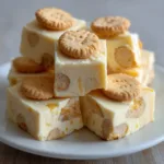 Close-up of Banana Pudding Fudge squares showing the matte texture and golden-brown wafer pieces.