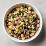 Overhead view of Chickpea and Black Bean Salad showing plump beige chickpeas and matte black beans.