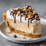 Amish Peanut Butter Pie: The Ultimate Creamy No-Bake Dessert Guide Close up of the matte tan peanut butter mousse layer and dense graham cracker crust of an Amish Peanut Butter Pie.