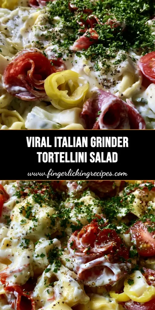 A towering glass bowl of Italian Grinder Tortellini Salad with glossy creamy dressing, bright red tomatoes, and fresh parsley garnish.