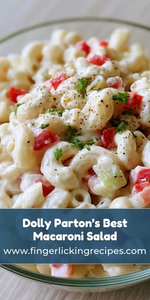 A top-down view of Dolly Parton's Macaroni Salad in a glass bowl featuring creamy dressing and red pepper bits. (Dolly Parton's Macaroni Salad)