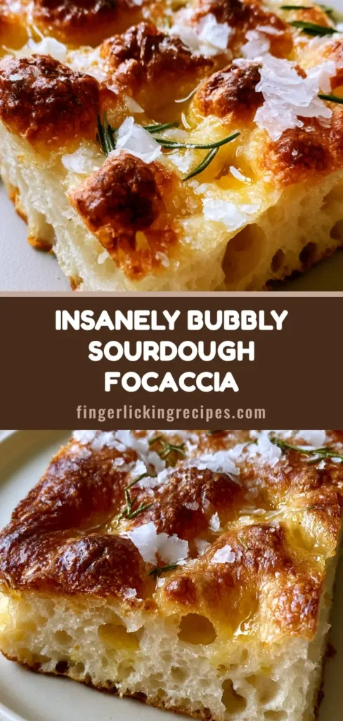 A thick, rectangular slice of sourdough focaccia with deep golden-brown crust, pooled olive oil, and rosemary needles. (Sourdough Focaccia)